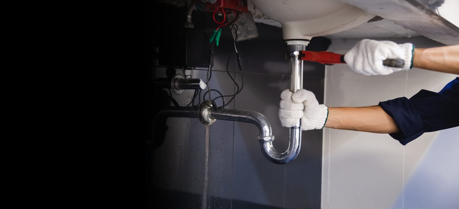 Plumber fixing drainage issues